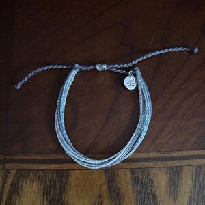 Pura Vida Blue and Gray Braided Bracelet adjusts leather
